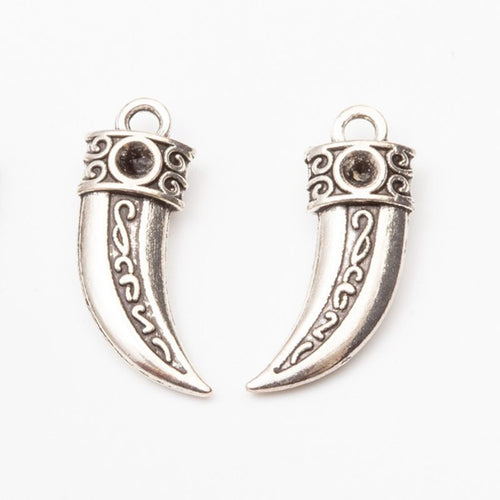 Detail view of engraved horn pendant showing finish variation 2