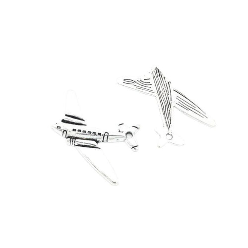 Airplane metal charm shown in a second front and reverse arrangement