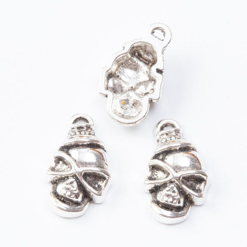 Masked Skull Charm Pendant front detail showing a skull face wrapped with a crossed bandana