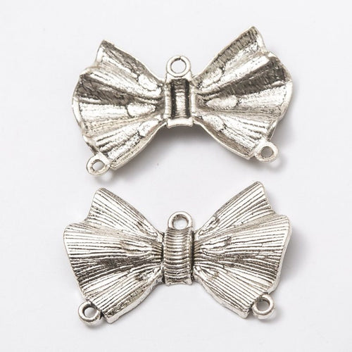 Textured Bow Metal Connector Charms close product view showing form and surface detail