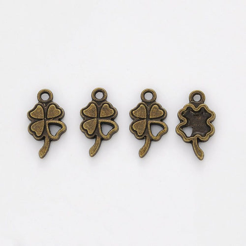 Close front view showing the shape and recessed details of the four leaf clover charms