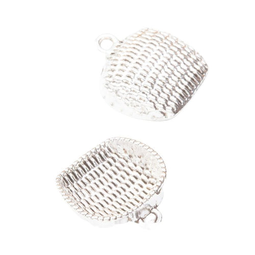 Close view of the dustpan shaped charm surface and relief