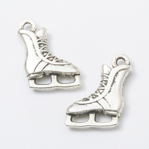 Product photo 2 of the ice skate charm highlighting its lace-up ice skate silhouette with an open blade