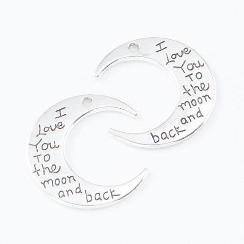 Front detail view of one pictured finish of engraved crescent moon charms