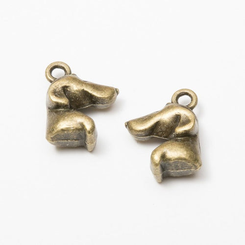 Dog Head Profile metal piece showing front-facing surface and relief detail