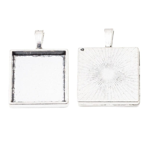 Close front view showing the shape and recessed details of the square cabochon pendant settings