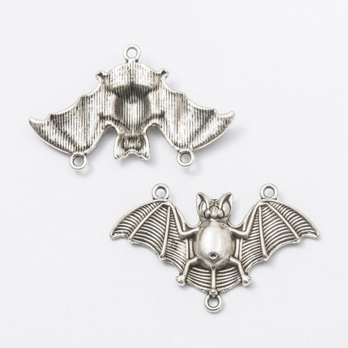 Close view showing the front and reverse details of the bat chandelier connector