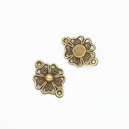 Openwork Flower Connector metal piece showing front-facing surface and relief detail