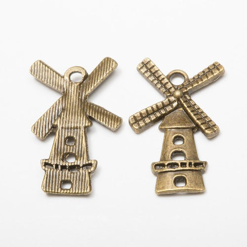 Close product view showing the front and reverse details of the windmill charm