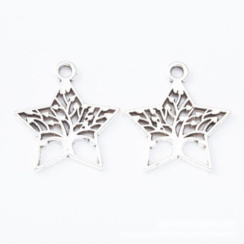 Open five-point star charms filled with branching tree silhouettes shown from the front on a white background.