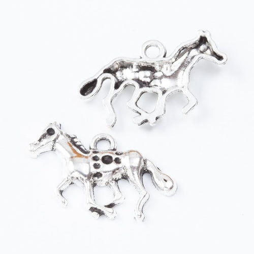 Close view of the running horse charm showing its raised front pattern