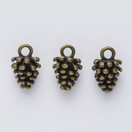 Textured Pine Cone Charm shown from the front in contrasting finishes
