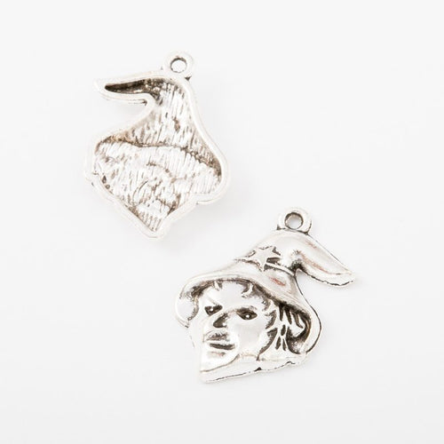 Closer view of the witch face charm surface and hanging loop