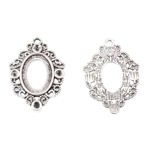 Ornate Oval Cabochon Setting shown from the front in contrasting finishes