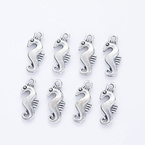Curled Seahorse metal piece showing front-facing surface and relief detail