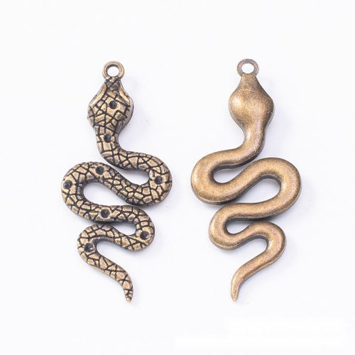 Closer product view of coiled snake charm shown against a plain background.