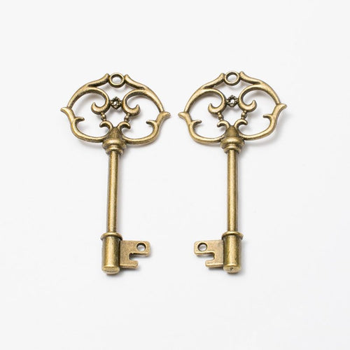 Close view of the floral bow key charm surface and relief