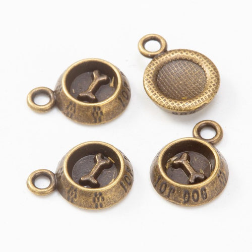 Close front and reverse view of the metal round dog-bone bezel charm