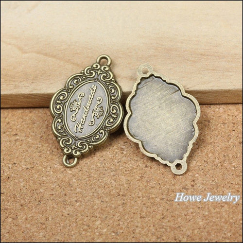 Oval Script Plaque Connectors showing front details and finish