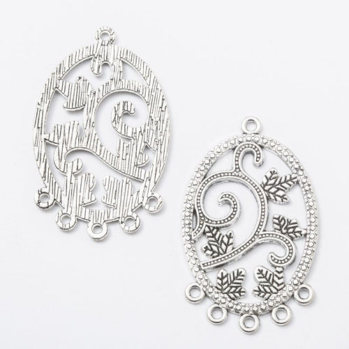 Close view of the relief and openwork details on the oval vine chandelier connector