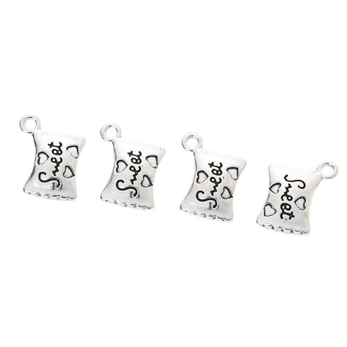 Grouped view of the sweet candy bag metal charm from the front