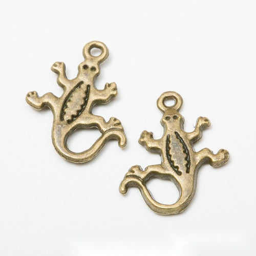 Close product view of the lizard and gecko metal charms in five antique variants