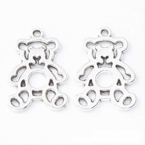 Front and reverse details of teddy bear charms on a white background