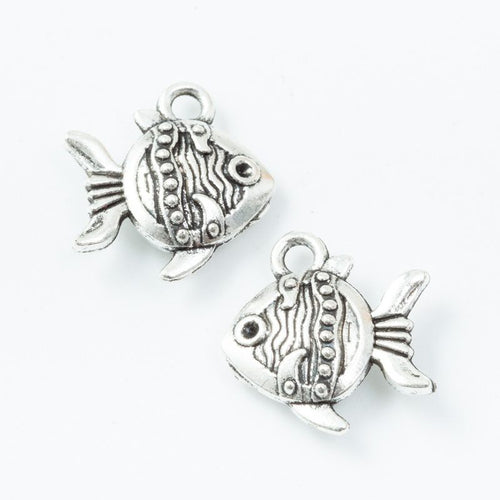 Front and reverse views of the patterned tropical fish metal charm in antique silver finish