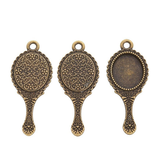 Close view showing the front details of the hand mirror bezel charms