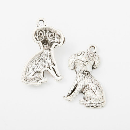 Sitting Shaggy Dog metal piece showing front-facing surface and relief detail