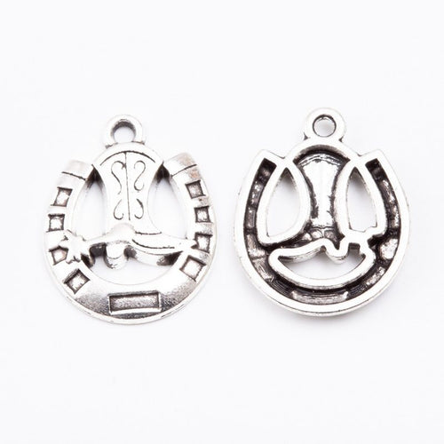 Close front view of horseshoe boot charm showing a boot centered inside a rounded horseshoe