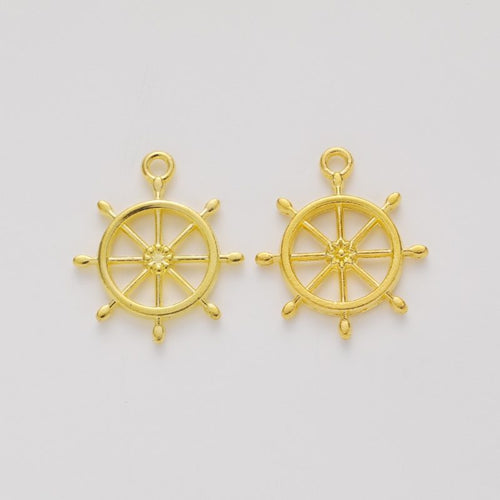 Front and reverse views of the slim ship wheel charm