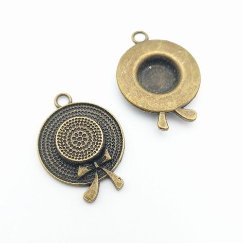 Close view of round hat and bow charm