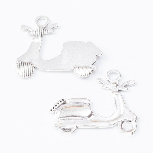 Close view of the scooter charm showing its raised front pattern