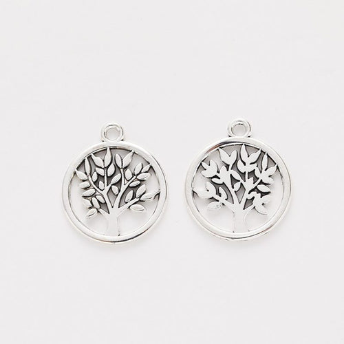 Close view showing the front and reverse details of the tree of life charm