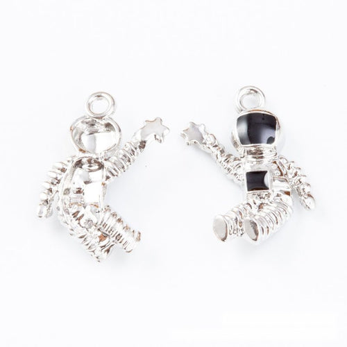 Astronaut charms with black visors and white suit details shown from the front on a white background.