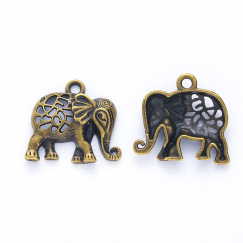 Close product view of the floral cutout elephant charm in two antique finishes