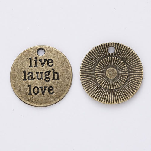 Front detail of live laugh love round metal charm