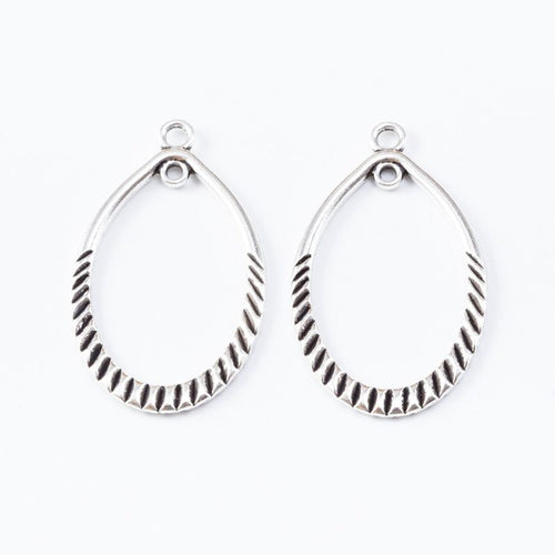 Front and reverse views of the ribbed open teardrop charm