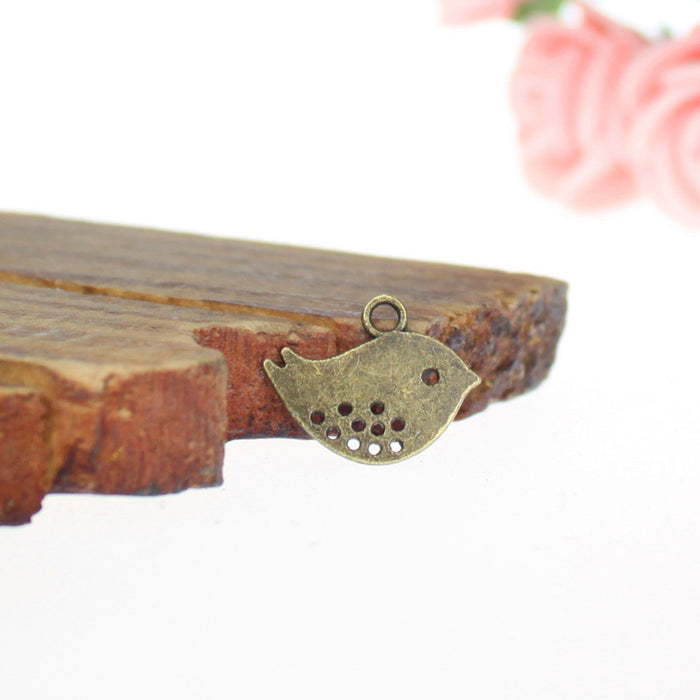Pierced Little Bird Alloy Charm in 3 Metal Finishes