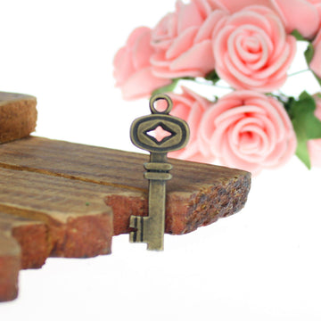 Pink Diamond Accent Key Alloy Pendant Charm in 3 Finishes