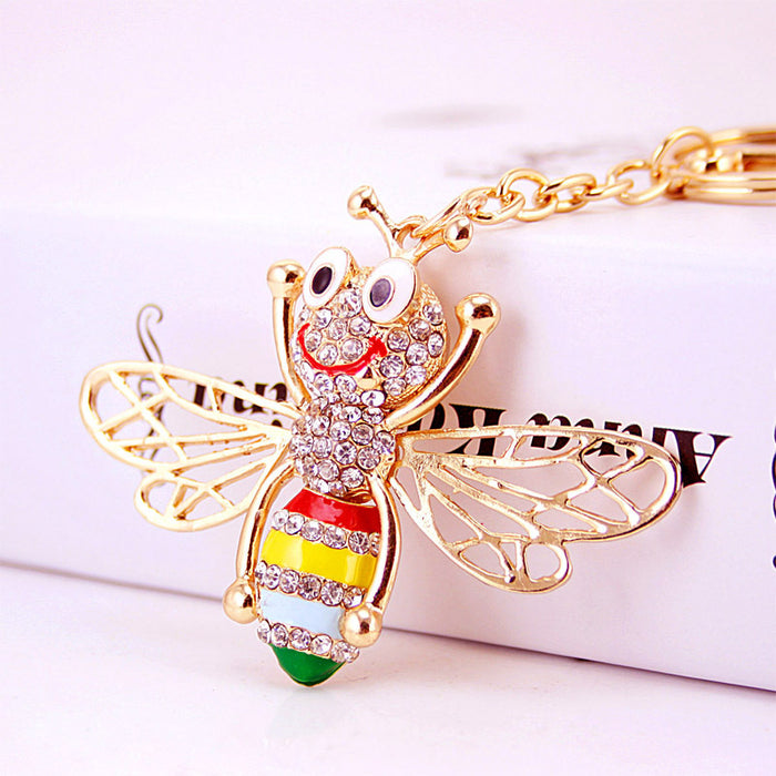 Gold-Tone Metal Bee Keychain With Clear Stones And Colorful Stripes