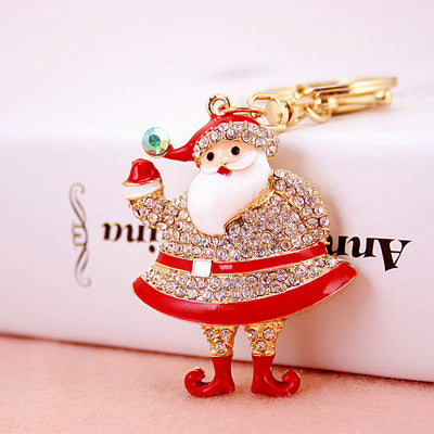 Close-up front view of a red Santa Claus charm covered with clear rhinestones.
