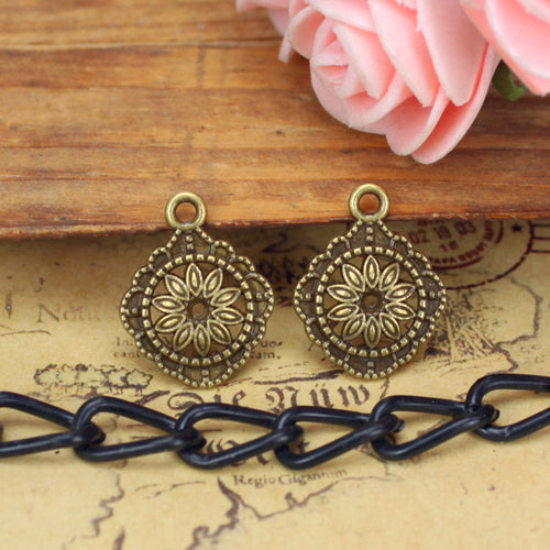 Diamond Floral Medallion Charm shown in grouped finish view