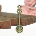 Long Shell Spoon Charm with Floral Handle in Three Finishes view 2