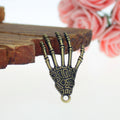 Skeletal Hand Metal Charm in Three Antique Finishes view 2