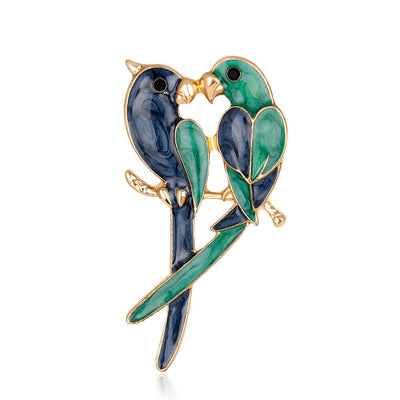 Front product view of the parrot brooch pin in blue and green