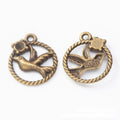 Bird in Round Frame Metal Charms in Two Antique Finishes view 4