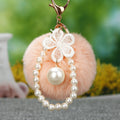 Faux Fur Pom Pom Keychain Collection With Pearl and Floral Charms view 5