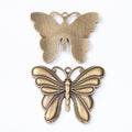 Antique Metal Layered Butterfly Charm Pendant With Textured Detail, 2 Finishes view 3